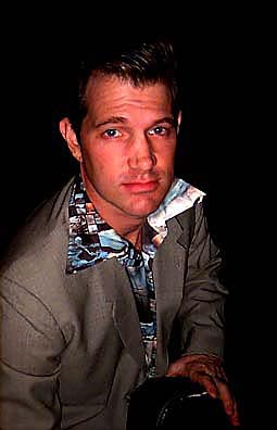 [Photo of Chris Isaak]