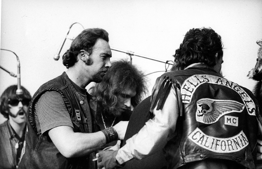 photo: Hells Angels, acting as security and hoodlums, and Jorma Kaukonen of the Jefferson Airplane at The Altamont 