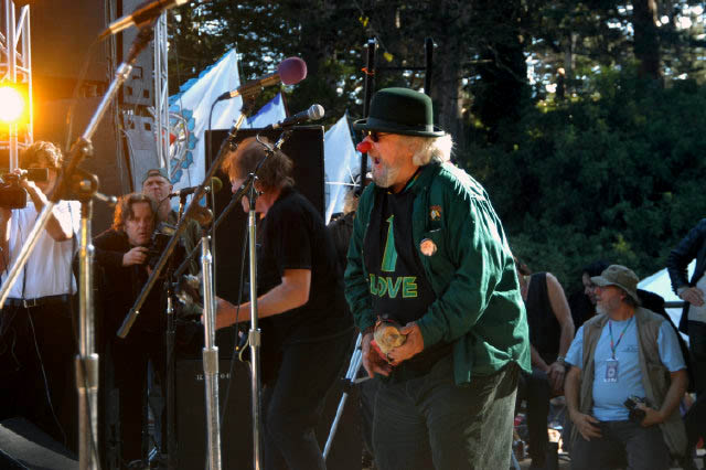 photo- Wavy Gravy slays 'em with air guitar