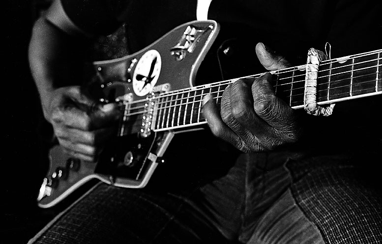 Bo Diddley playing guitar